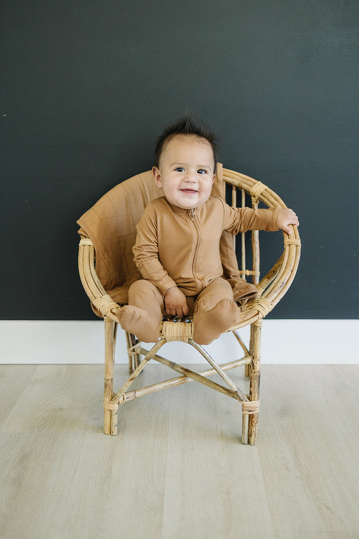 Mustard Bamboo Footed Zipper displayed to show sizing and fit details of this bamboo footie pajama