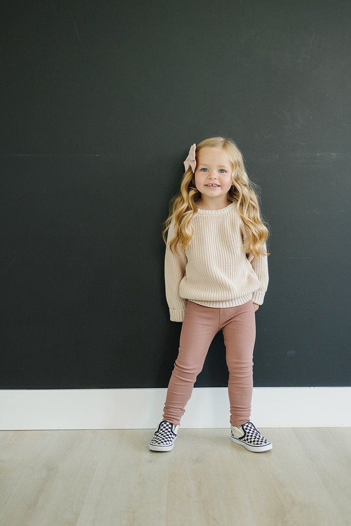 Toddler wearing the Mebie Baby organic cotton leggings in color dusty rose