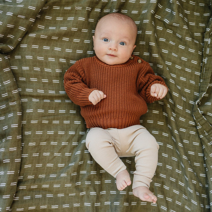 Organic cotton baby leggings with ribbed waistband, the Oatmeal Organic Leggings laid flat to show the ribbed waistband.