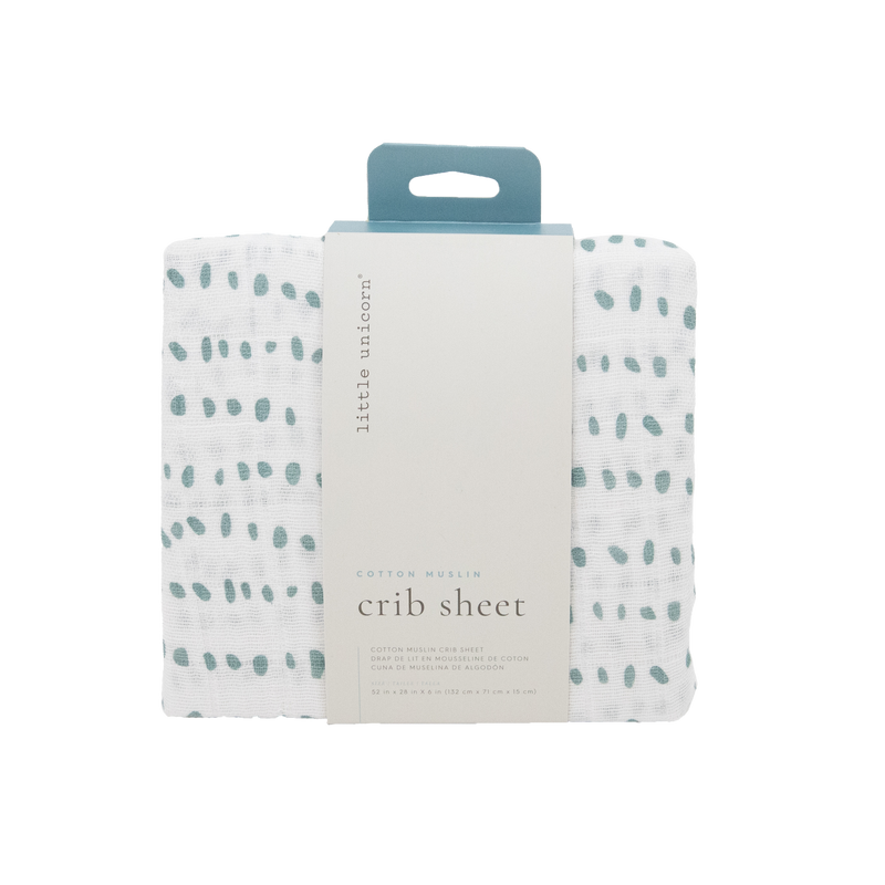 Minimalist and cozy, the Little Unicorn Cotton Muslin Crib Sheet - Stone Stripe offers premium organic cotton crib sheets for nurseries.