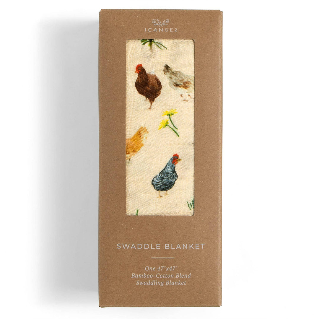 1canoe2 Chicken Meadows baby swaddle in retail packaging, a muslin swaddle blanket ready to gift newborns