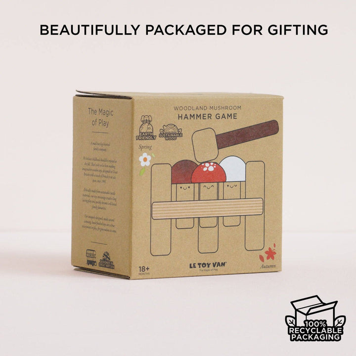 Le Toy Van's Woodland Mushroom Hammer Game pictured next to its printed box illustration