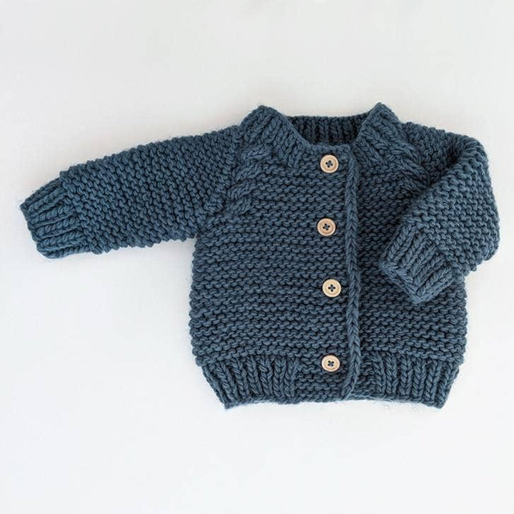 Huggalugs Slate Garter Stitch cardigan, hand knit baby sweater with wooden buttons, flat lay
