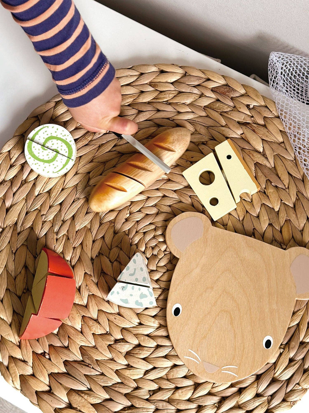 Made from wood, the Tenderleaf Toys Cheese Chopping Board is a charming toy for kids to develop skills.
