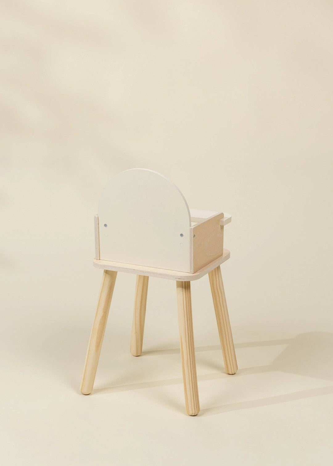 Back view of the Coco Village Wooden Dolls' High Chair highlighting its sturdy wood frame