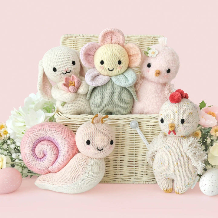 Hand-knit snail stuffed animal Peony Cuddle + Kind — fair trade plush toy best baby girl gift
