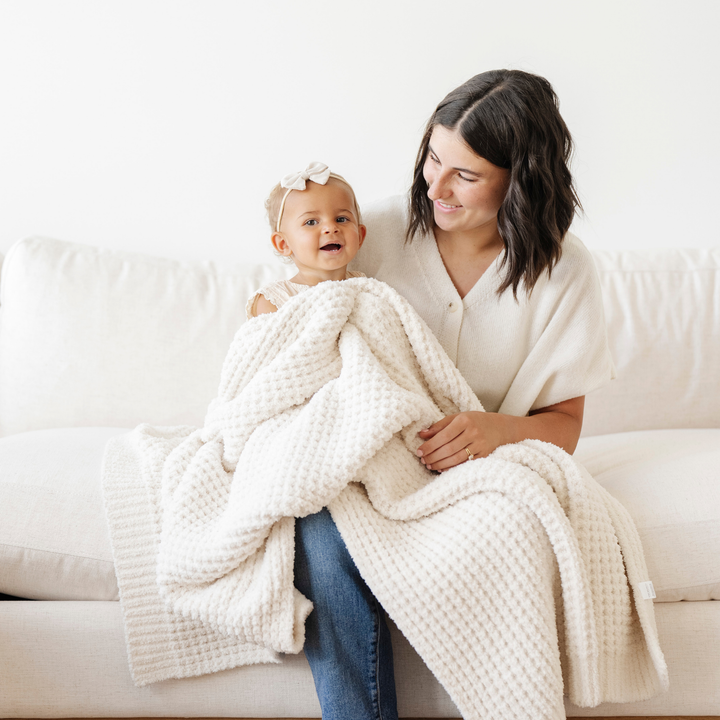 Swan Saranoni Waffle Knit Receiving Blanket serves as a comfy toddler blanket for naps or lounging.
