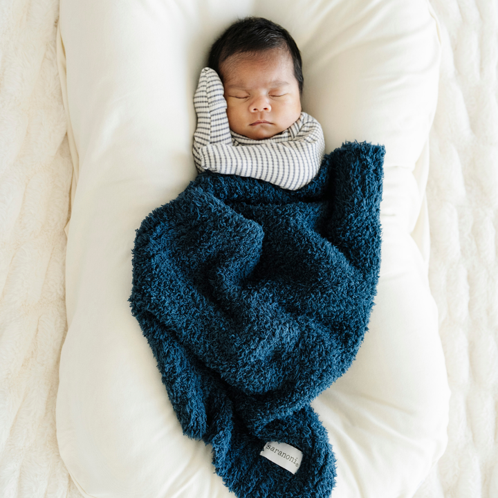 Luxuriously soft, the Saranoni BAMBONI¨ Mini Blanket in Nautical Blue offers gentle comfort, a soothing baby blanket for little ones.