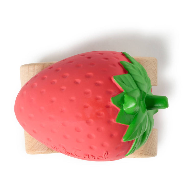 Sweetie the Strawberry Baby Car resting on its side to display the natural rubber body