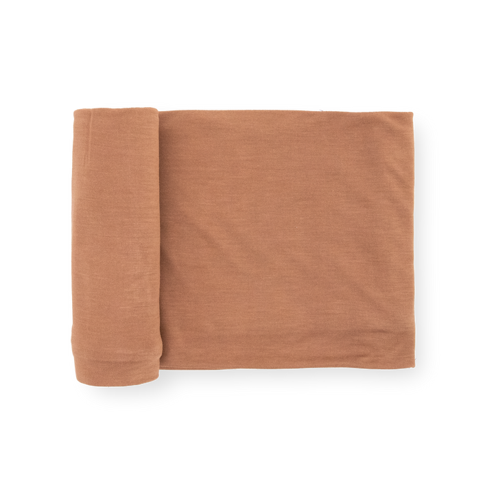 Little Unicorn Stretch Knit Swaddle Blanket in Terracotta, soft baby blanket for newborns.