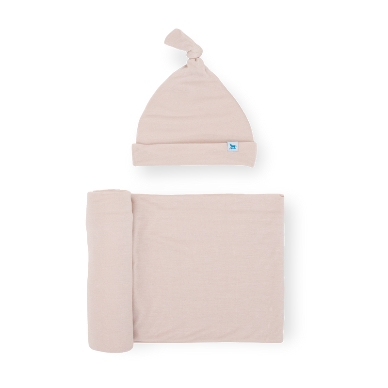Little Unicorn Stretch Knit Swaddle and Hat Set - Soft Blush folded neatly, soft muslin blankets for newborn comfort