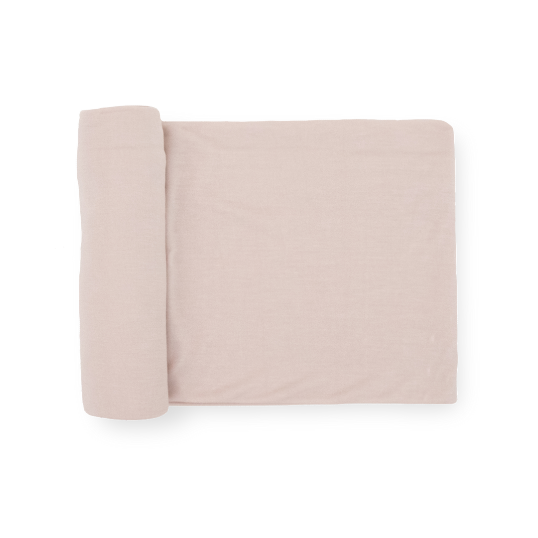 Little Unicorn Stretch Knit Swaddle Blanket in Soft Blush, soft baby blanket for newborns.