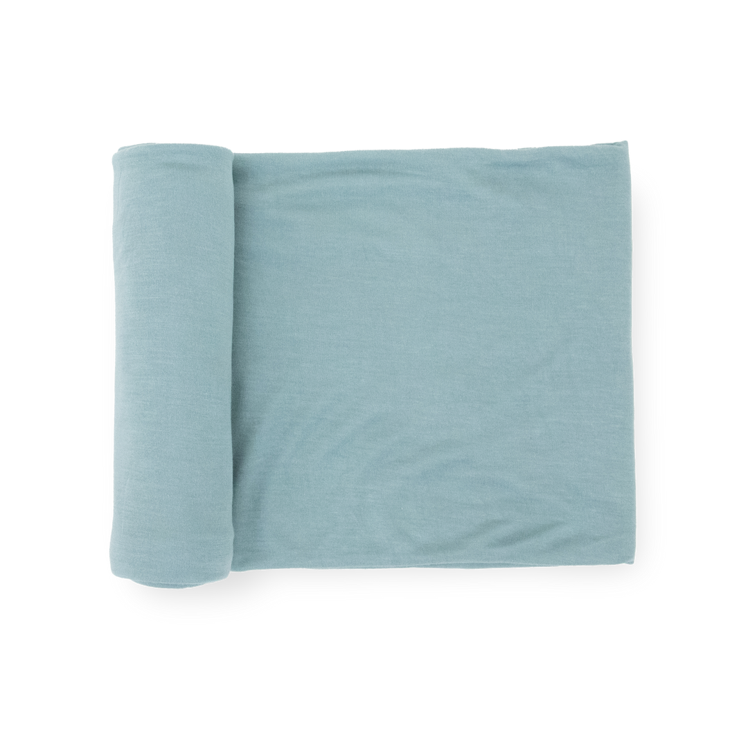 Little Unicorn Stretch Knit Swaddle Blanket in Harbor, soft baby blanket for newborns.