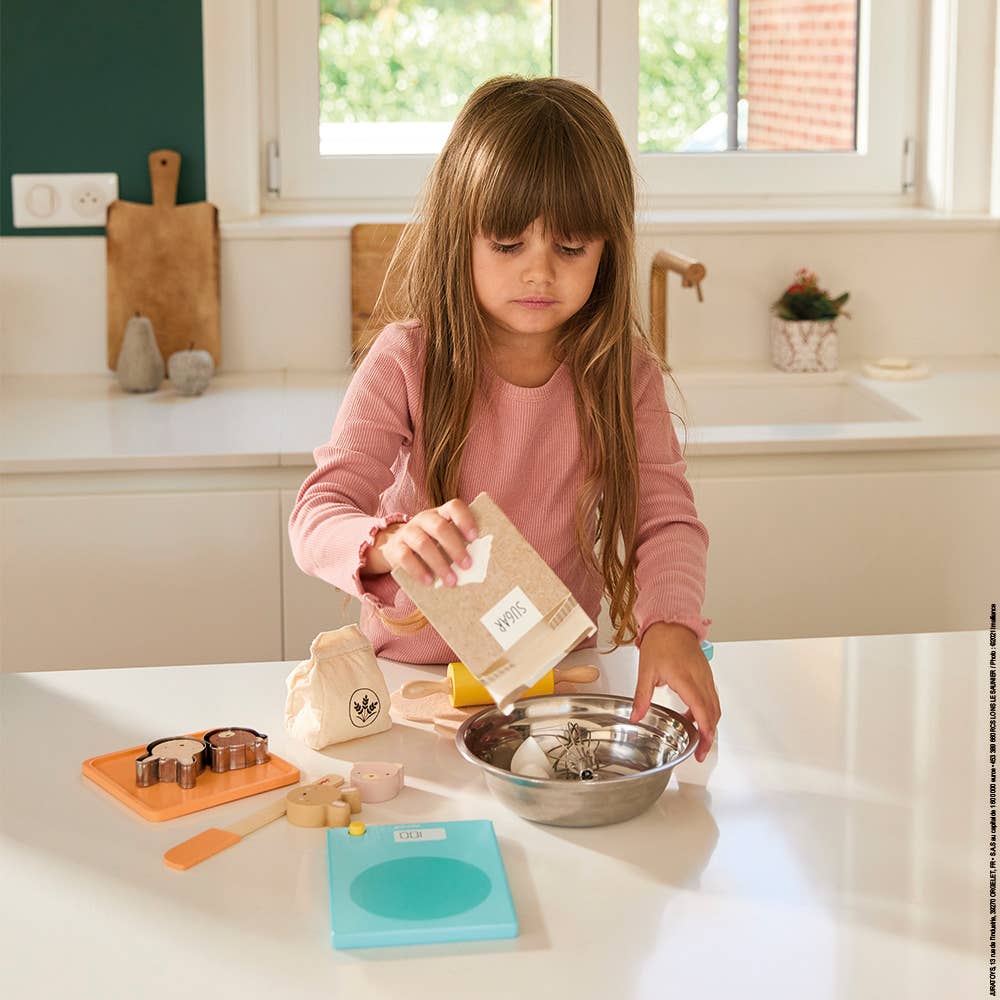 Kids kitchen toy Janod My Pastry Workshop laid out on table