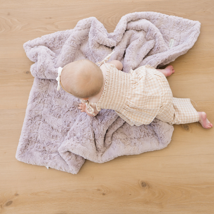 In Lilac, the Saranoni Dream Receiving Blanket surrounds your little one with soothing softness, perfect for baby girl blankets.