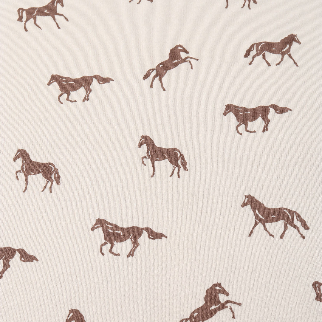 MakeMake Organics 2-Way Zip Romper Horses lifestyle - playful graphic organic cotton baby outfit