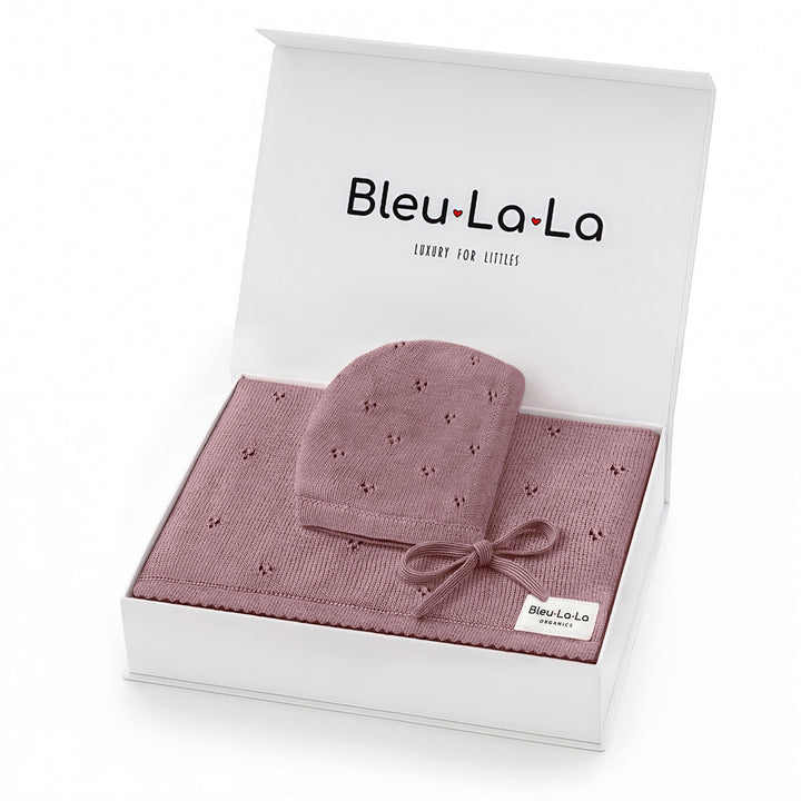 Bleu La La Organic Pointelle Swaddle Blanket + Hat Gift Set in sugar plum, neatly boxed to display pointelle knit texture.