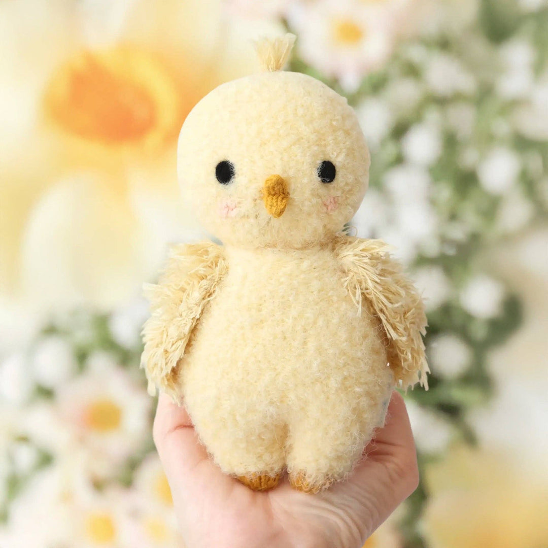 Buttercup yellow bouclé chick — Cuddle + Kind heirloom-quality hand-knit stuffed animal for toddlers