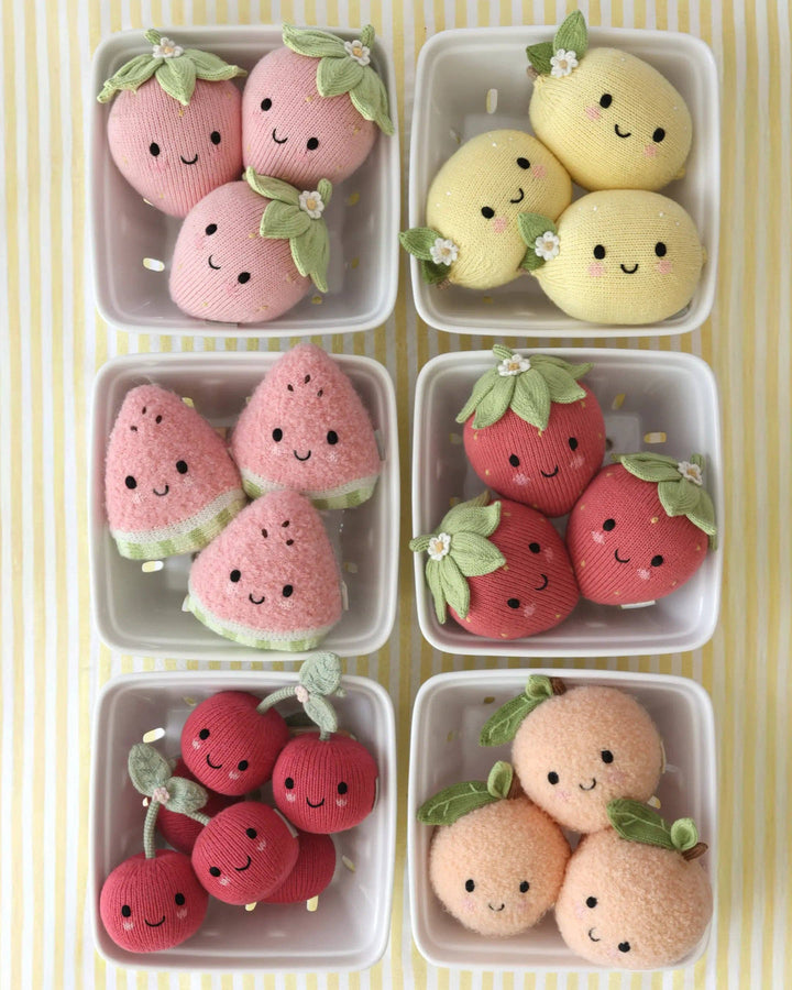 Soft cotton knit strawberry plush toy Cuddle + Kind Baby Strawberry, a sweet nursery keepsake