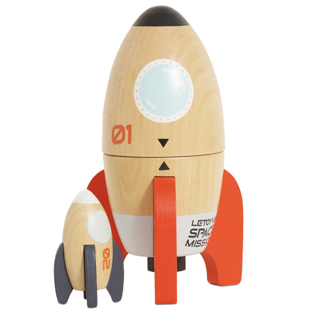 Natural wood rocket with orange fins beside a mini rocket with grey fins, Le Toy Van Magnetic Space Rocket Duo toy for kids