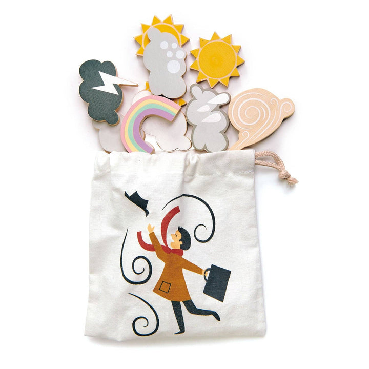 Nine magnetic weather symbols spilled from the printed drawstring bag included with Weather Watch