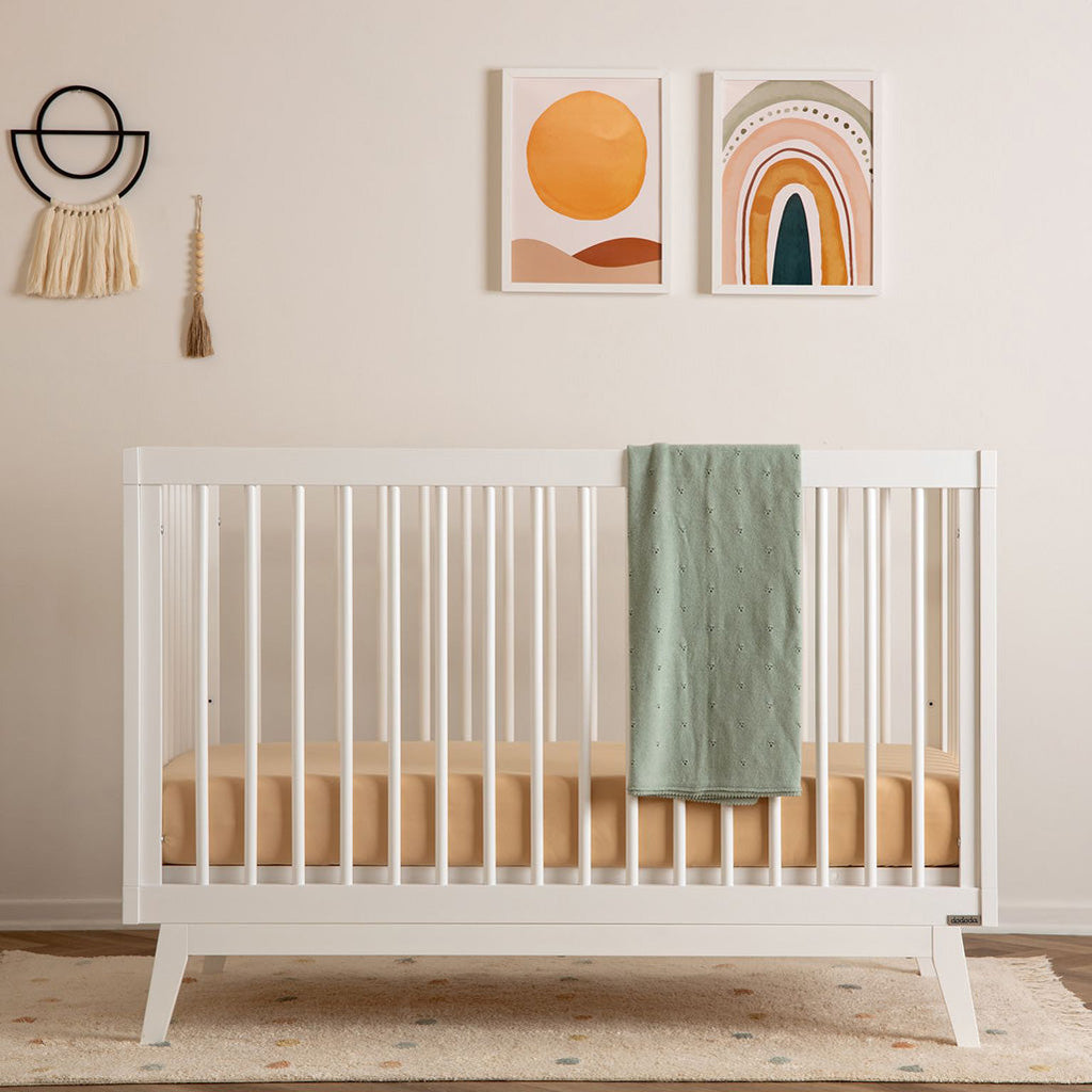dadada White Soho 3-in-1 Convertible Crib to Toddler Bed Furniture. Shown in a nursery. Best baby cribs