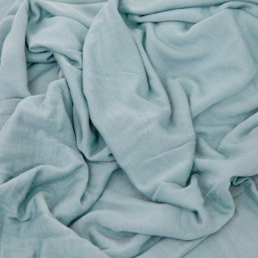 Wrap your baby in comfort with Little Unicorn Harbor Muslin Swaddle, perfect muslin blankets.