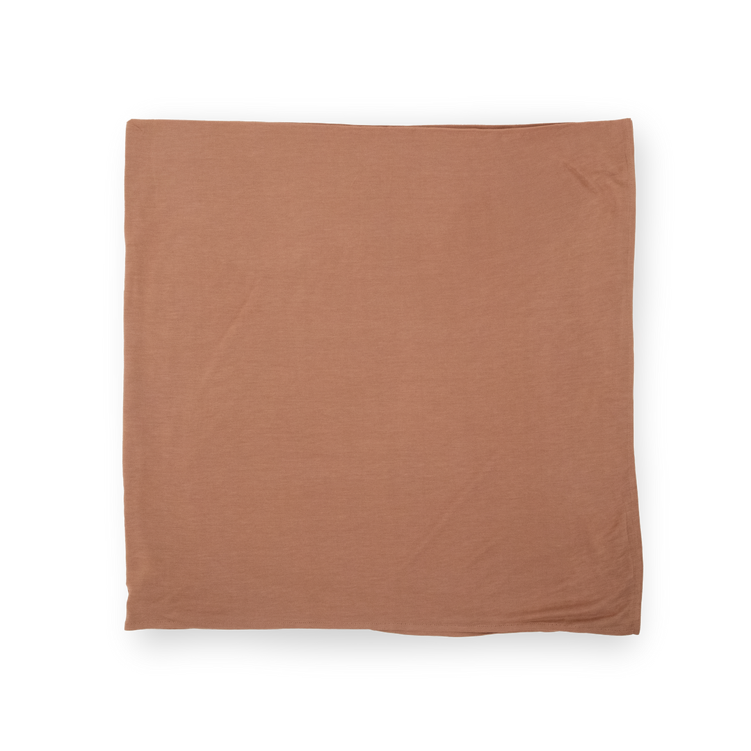 Gentle infant muslin blankets by Little Unicorn, Stretch Knit Swaddle Blanket in Terracotta.