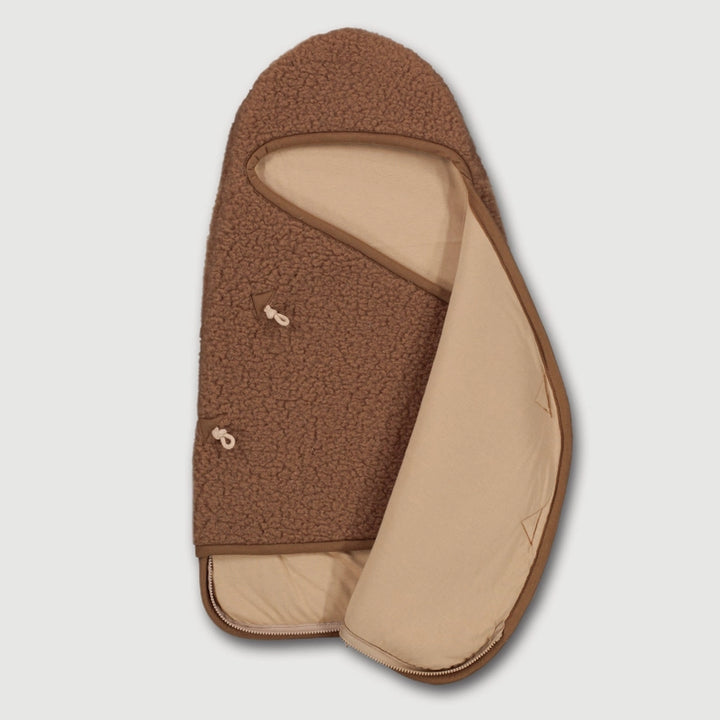 Soft and breathable, the Finch & Fable Wool Cocoon in Caramel is the best sleep sack for baby nap time and nighttime sleep.