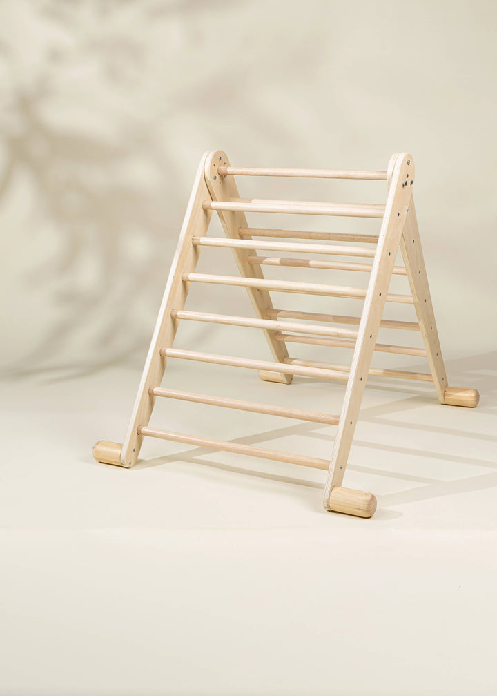 Build confidence through motion with the Coco Village Montessori 2-in-1 Triangle & Wall Climber in Natural, a purposeful developmental toy.