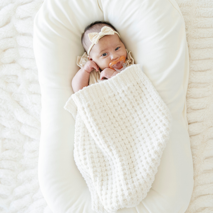 Swan Saranoni Waffle Knit Mini Blanket keeps things minimal, breathable, and light which makes it a Best baby blanket choice.