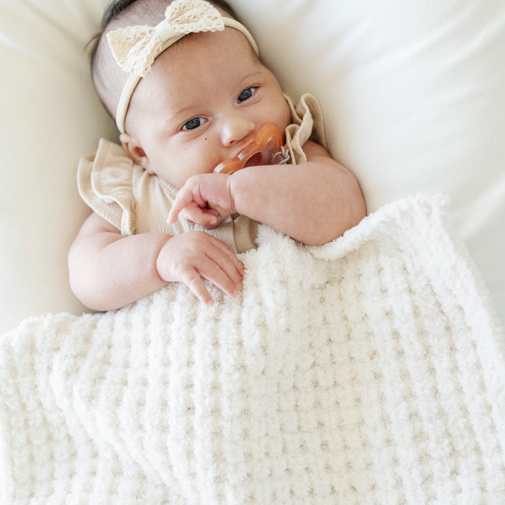 Swan Saranoni Waffle Knit Mini Blanket stays timeless and airy, offering comfort parents love in Baby blankets.