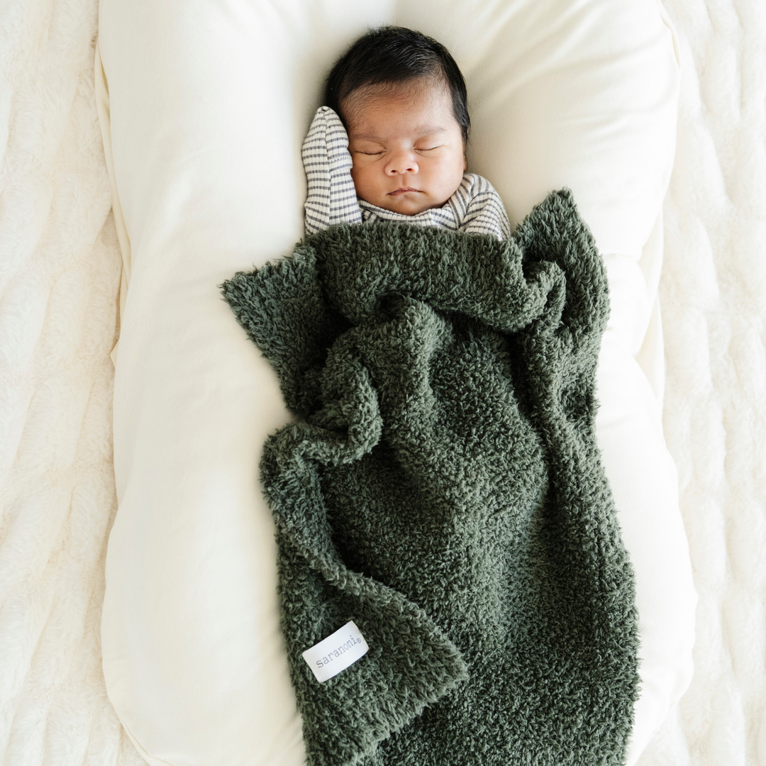 For cozy nights, the Saranoni BAMBONI¨ Mini Blanket in Juniper is the perfect baby boy blanket.