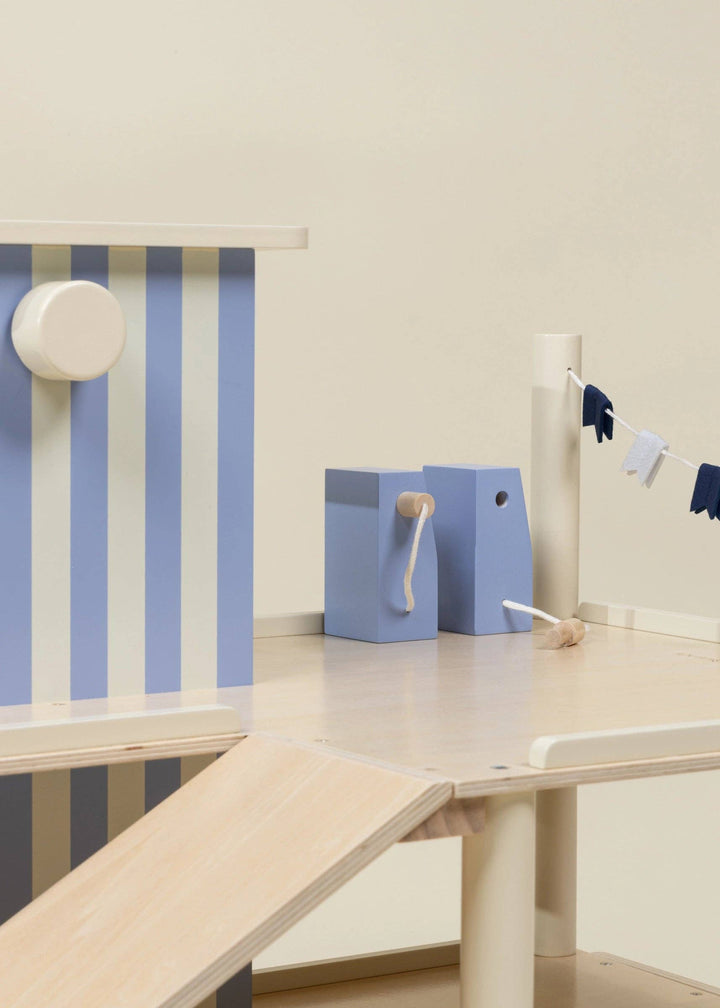 Wide angle of the top platform on Coco Village's Wooden Parking Garage Playset with pennant flags