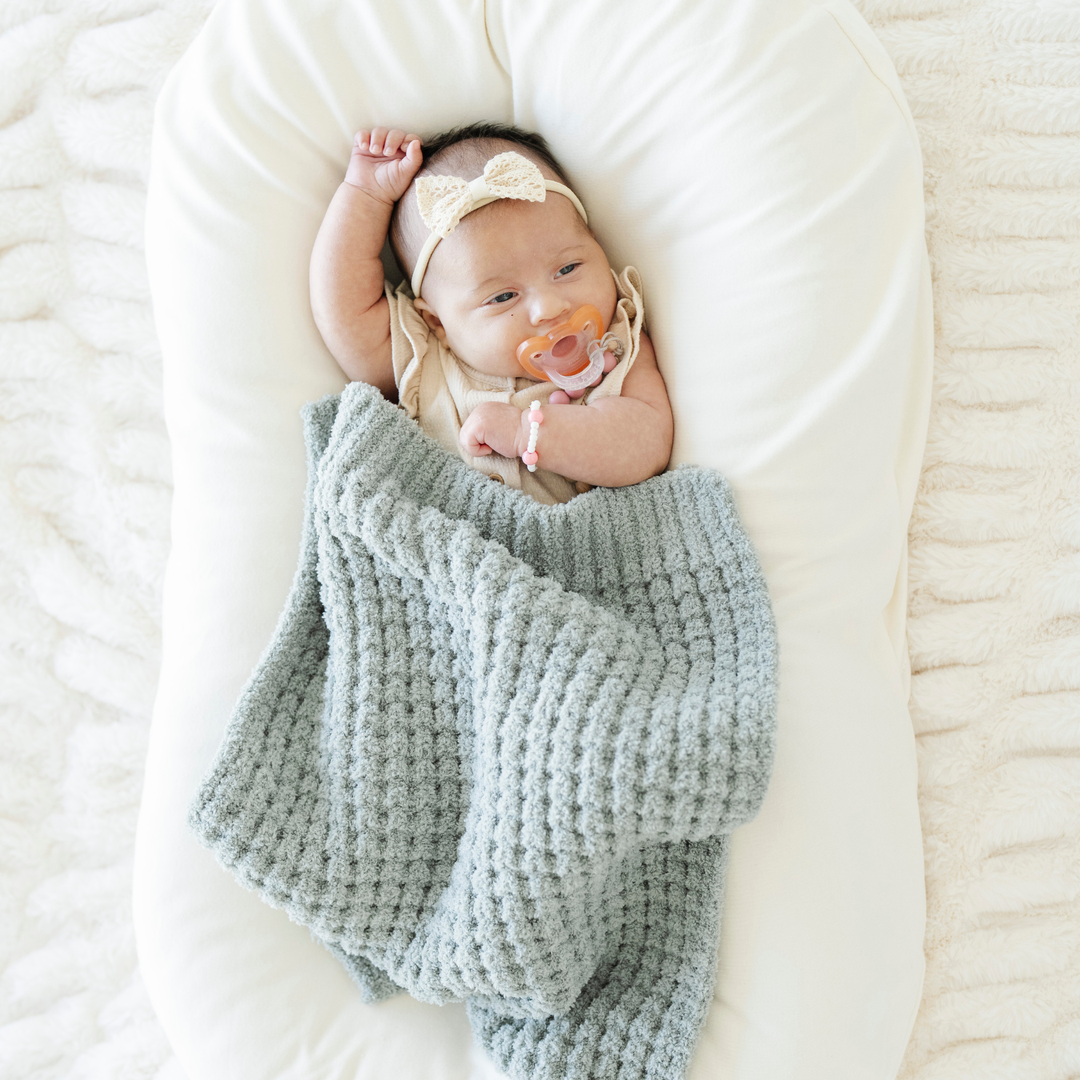 Choosing Elm in the Saranoni Waffle Knit Mini Blanket adds a premium feel and luxe weight, ideal as the Best baby blanket.