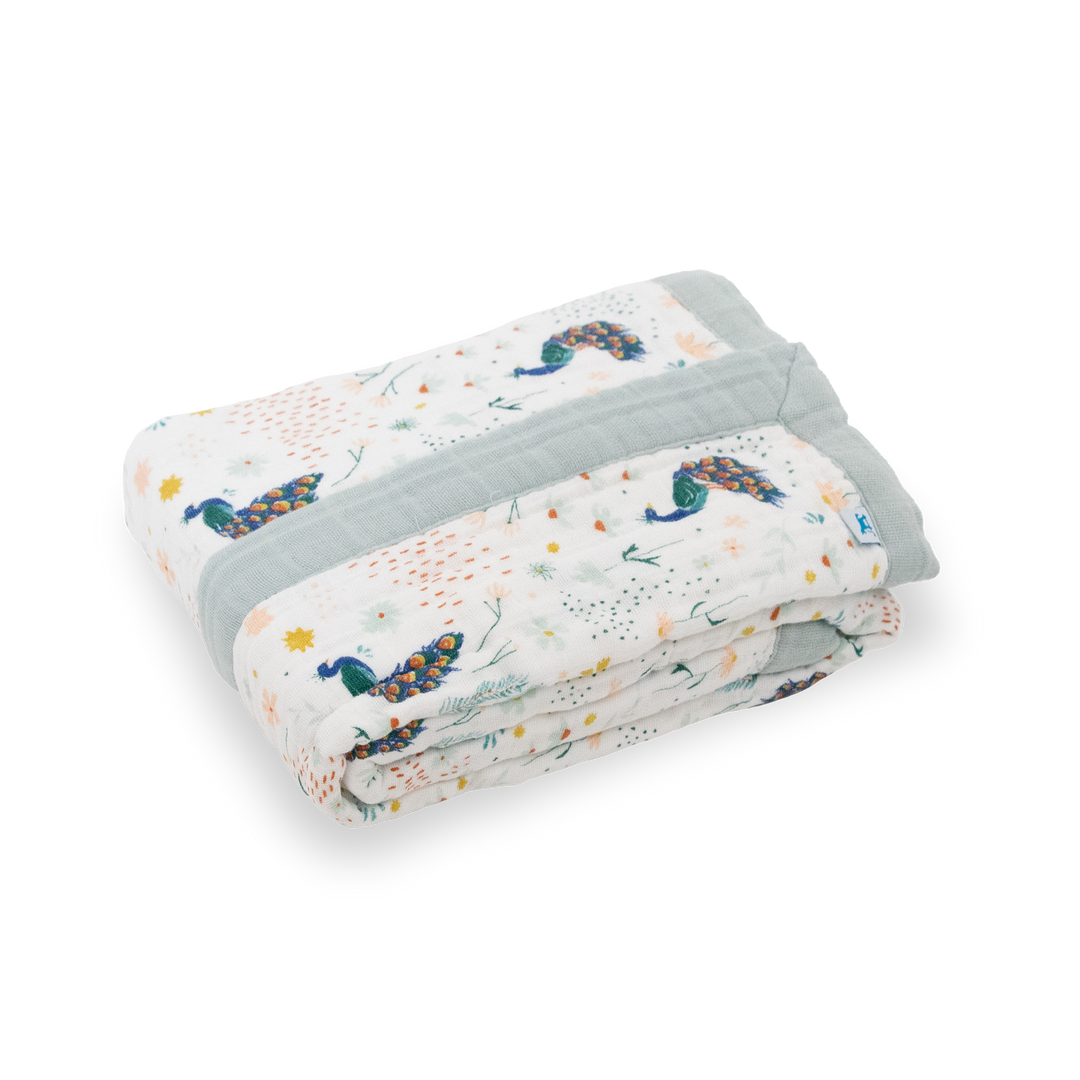 Beautifully folded Little Unicorn Cotton Muslin Baby Quilt - Peacock, crafted from soft breathable muslin for everyday comfort.