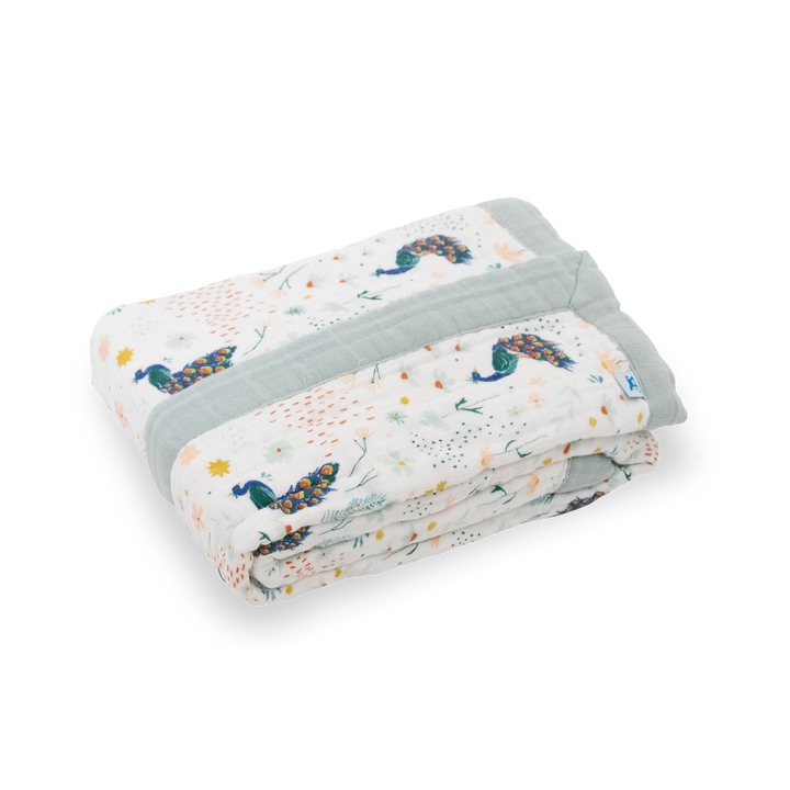 Beautifully folded Little Unicorn Cotton Muslin Baby Quilt - Peacock, crafted from soft breathable muslin for everyday comfort.
