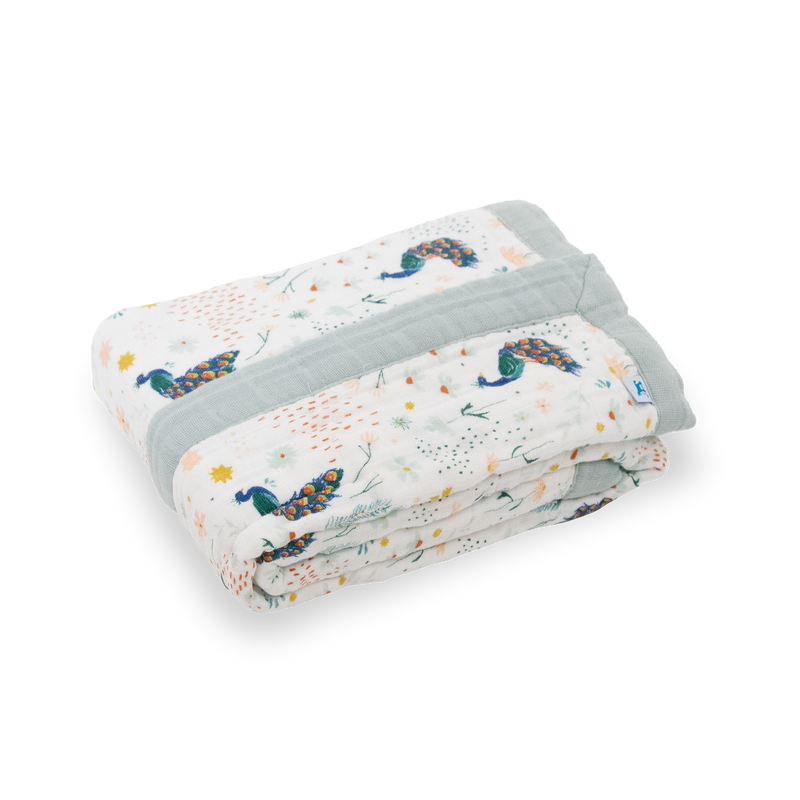 Beautifully folded Little Unicorn Cotton Muslin Baby Quilt - Peacock, crafted from soft breathable muslin for everyday comfort.
