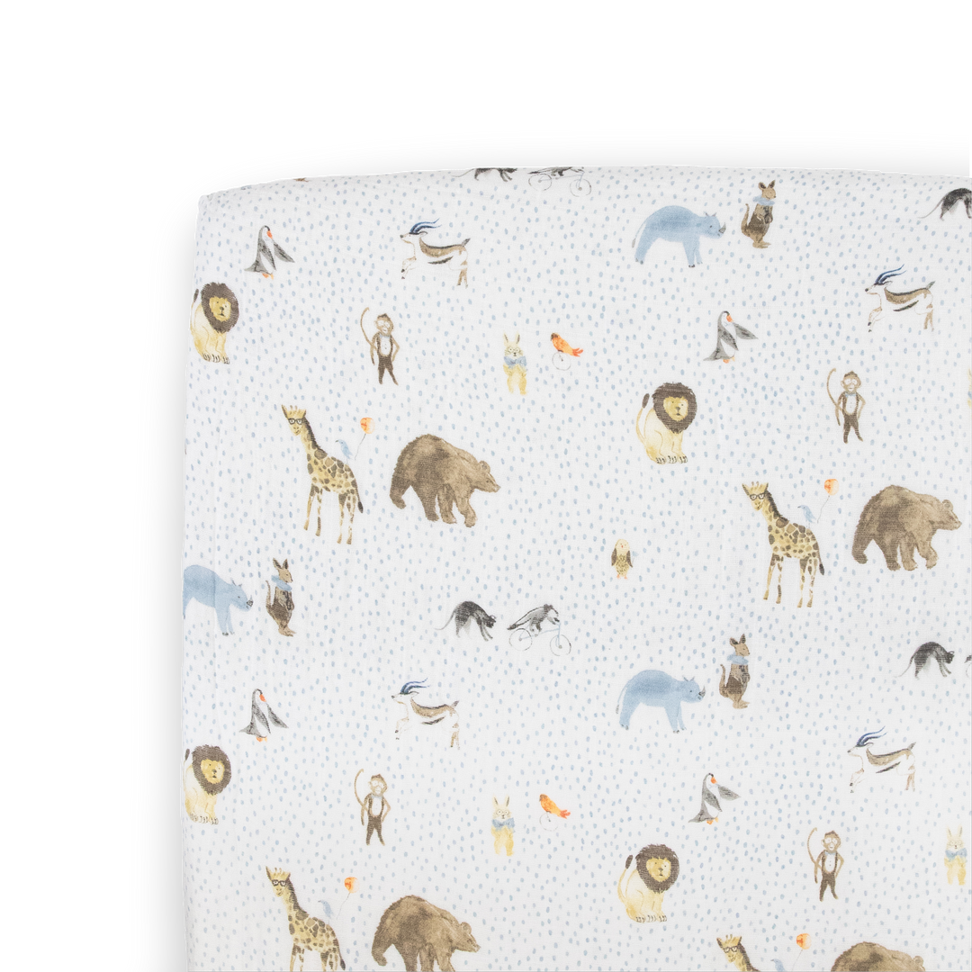 Little Unicorn Cotton Muslin Crib Sheet - Party Animals folded display, soft breathable cotton crib sheets with playful animal print.