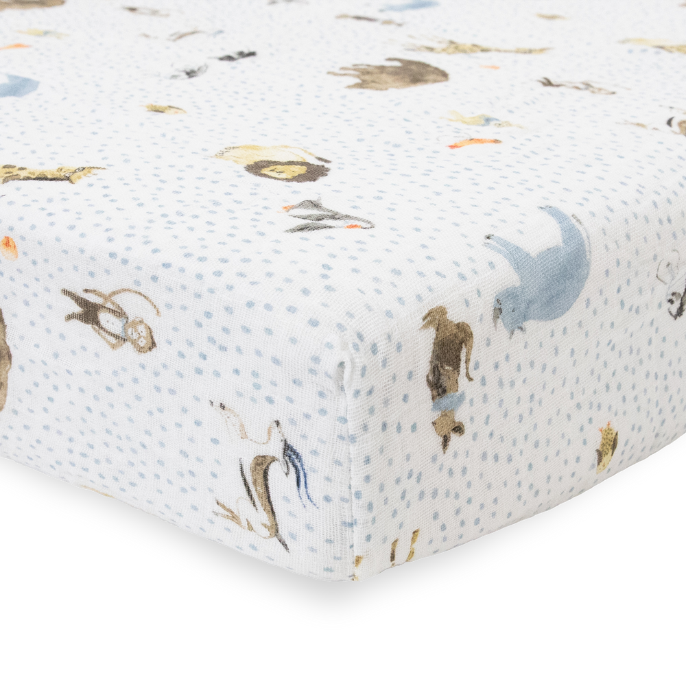Adorable zoo-themed Little Unicorn Cotton Muslin Crib Sheet - Party Animals, perfect fitted crib sheet for baby nurseries.