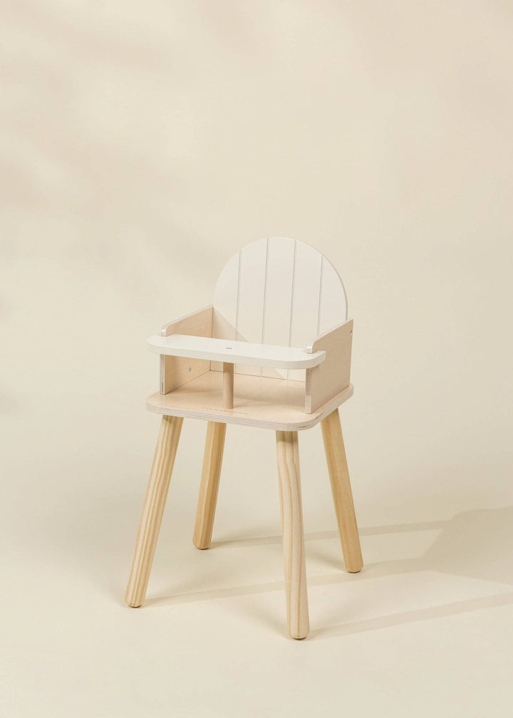 Coco Village Wooden Dolls' High Chair displayed at an angle showing wood legs and tray design