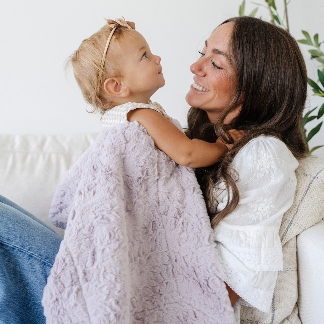Soft to the touch, the Saranoni Dream Receiving Blanket in Lilac delivers everyday comfort as a must-have newborn receiving blanket.