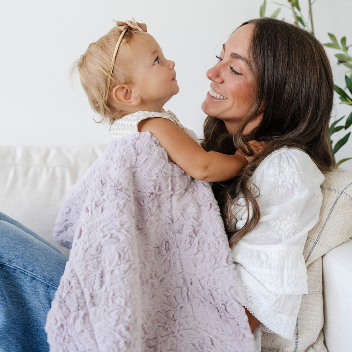 Soft to the touch, the Saranoni Dream Receiving Blanket in Lilac delivers everyday comfort as a must-have newborn receiving blanket.