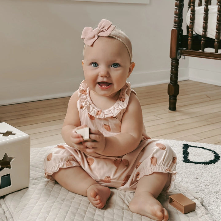 Gunamuna Bubble Romper in Strawberry, adorable baby romper for comfort and playful style.