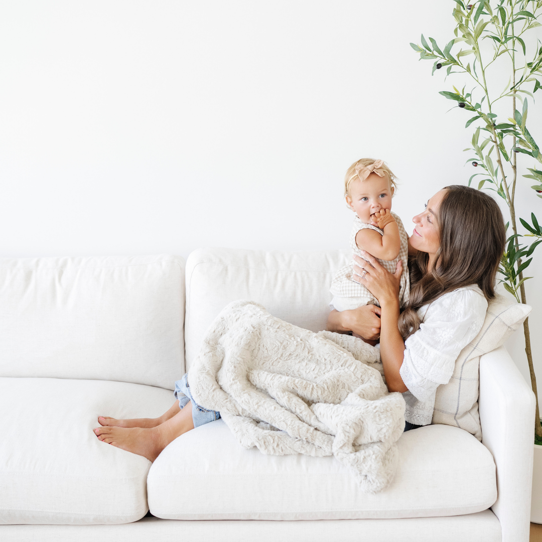 For newborn comfort, the Saranoni Dream Receiving Blanket in Oat offers velvety warmth as a soft baby blanket.