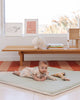 Baby laying down  on the machine washable Piccalio play mat.