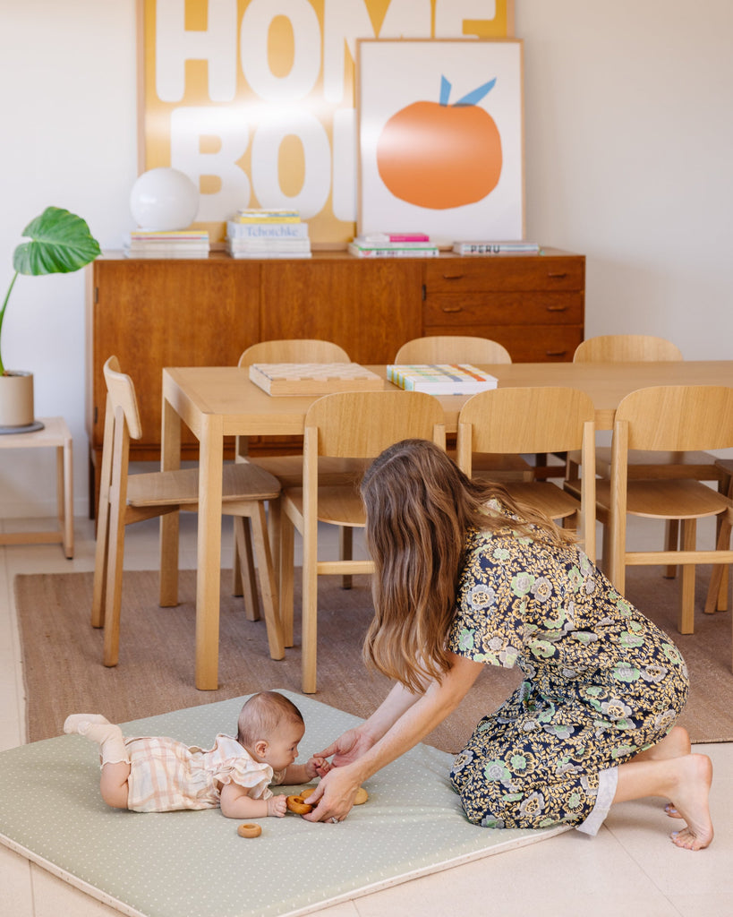 Mom and baby playing on the Piccalio play mat.