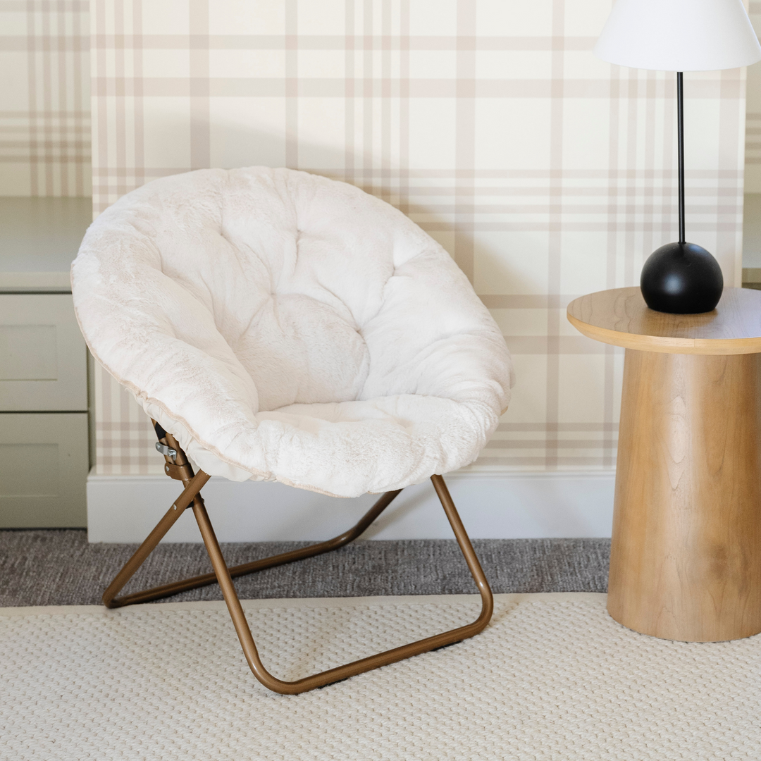 Kids will love the Saranoni Saucer Chair in Cream as a stylish and comfy lounge chair.