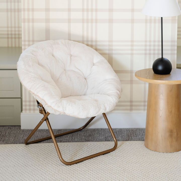 Kids will love the Saranoni Saucer Chair in Cream as a stylish and comfy lounge chair.