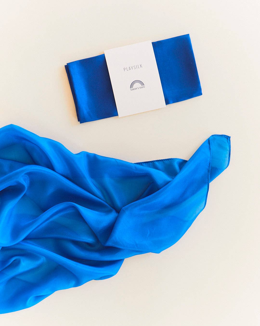 Sarah's Silks Solid Color Playsilk, an open ended play favorite, royal blue scarf flat lay